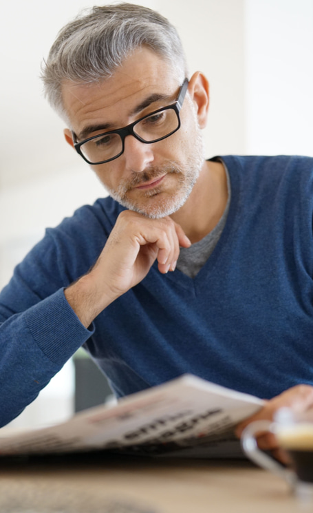 middle aged man reading glasses