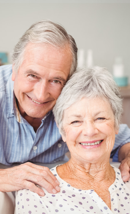 happy senior couple without glasses