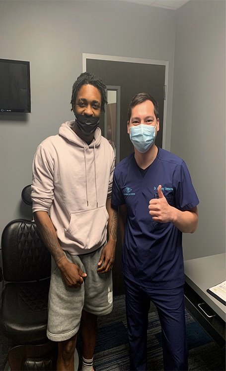 Dr. Anthony Vanrachack with a happy patient