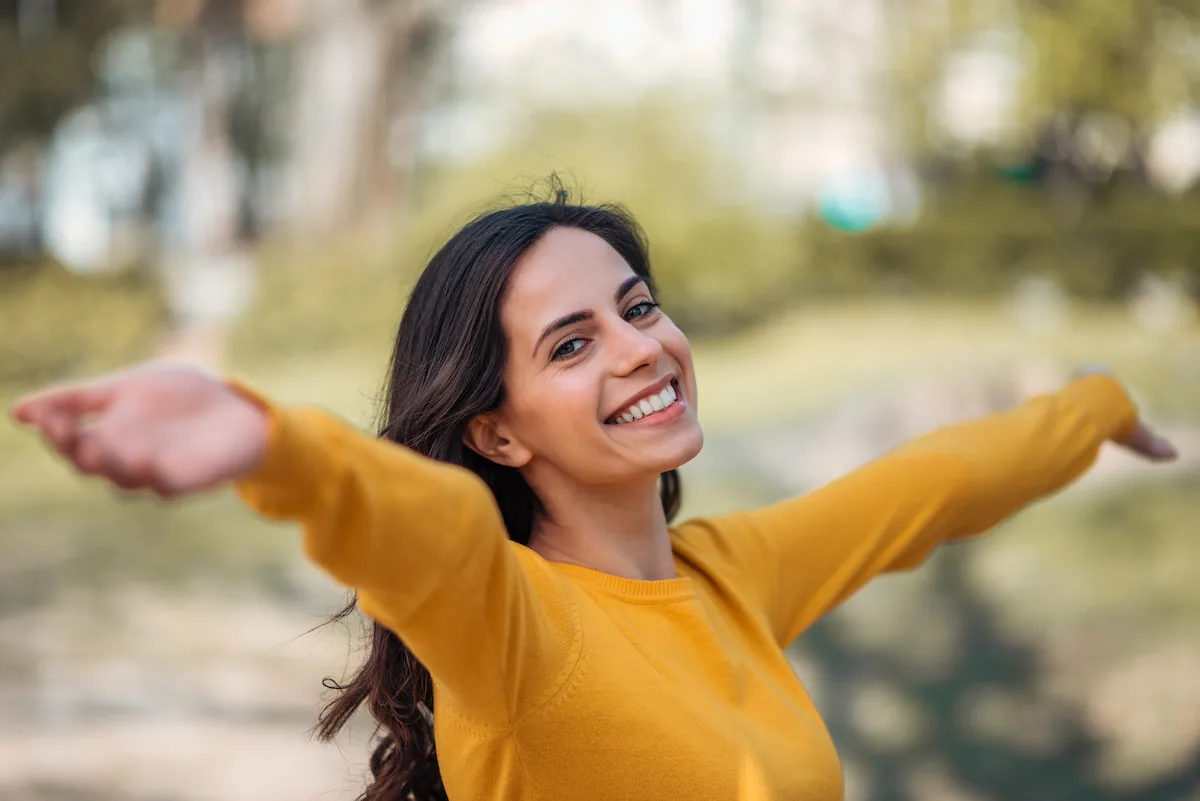 pretty millennial smiling outside